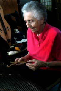 picture of Patty playing a hammered dulcimer